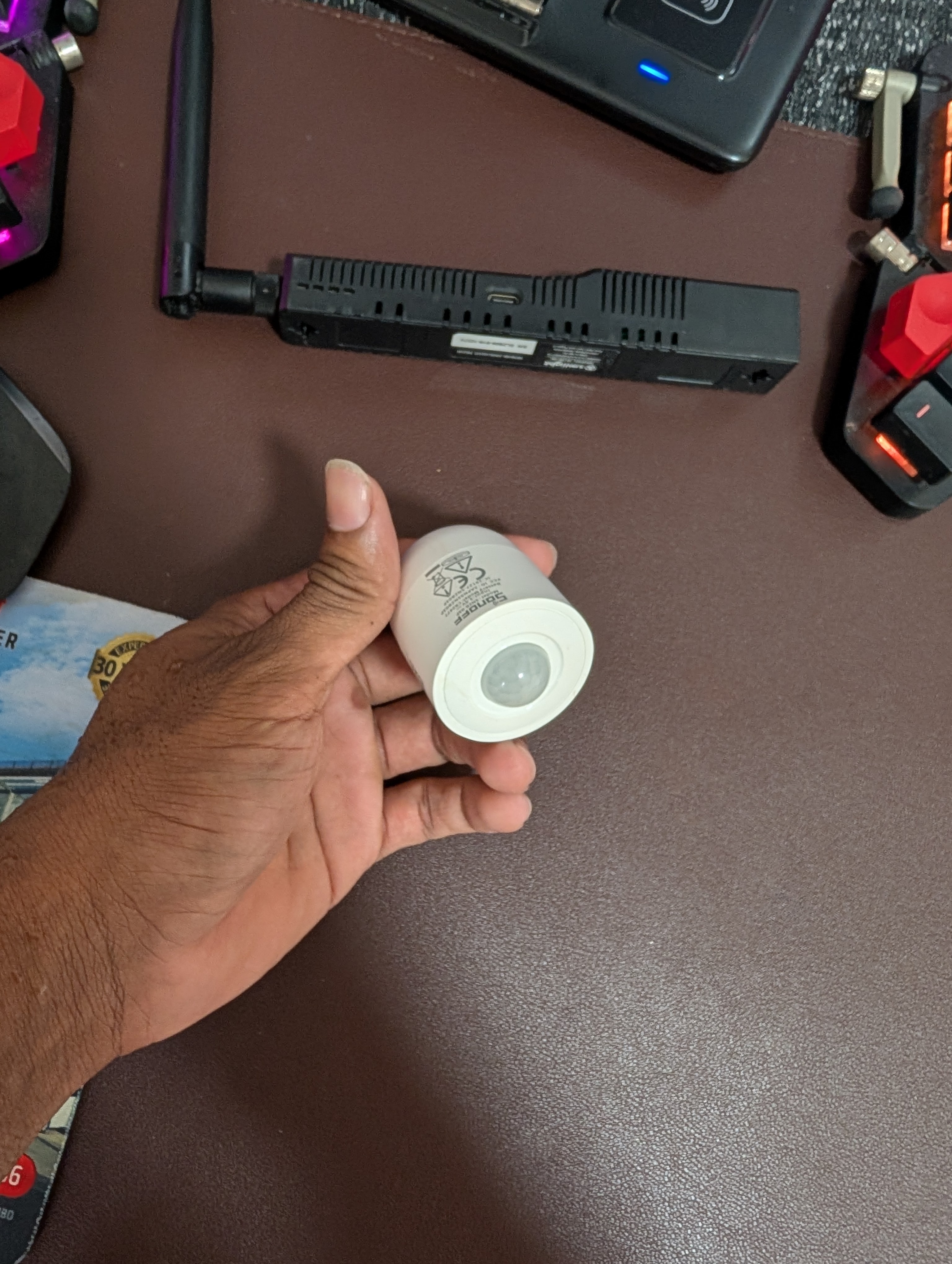sonoff zigbee PIR motion sensor in hand